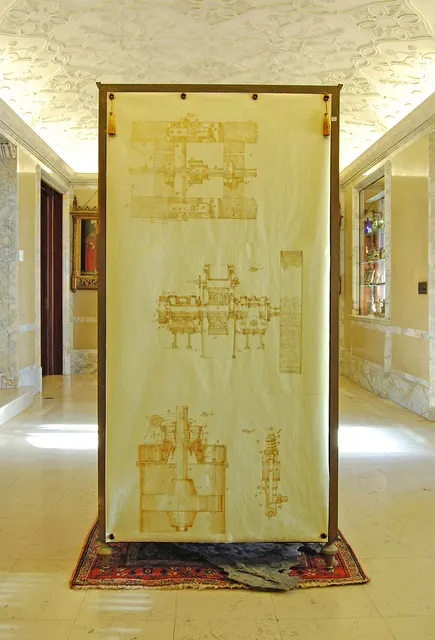 Alembic I: back of west cabinet with golden Allis patent drawings