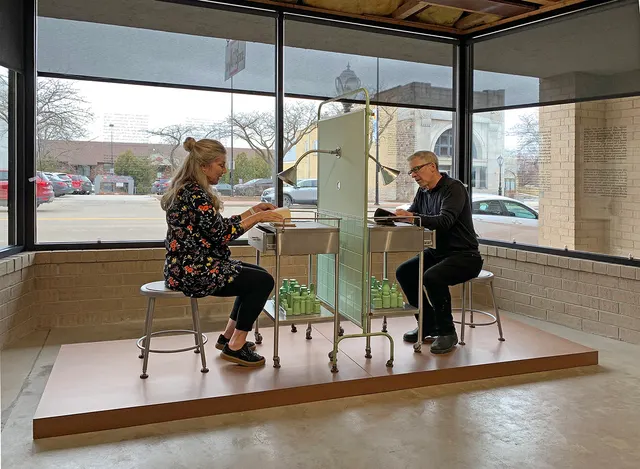 Miasma I: Causae et Curae: viewers examining chained books