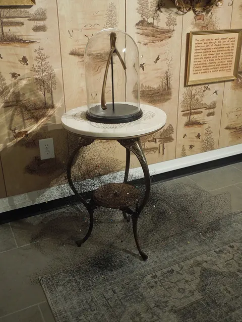 Miasma III: Pestilence and Providence: table with bronze wishbone dome and beaded miasma net