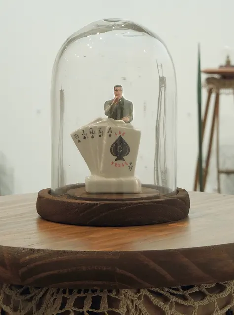 Miasma III: Pestilence and Providence: man and playing cards dome