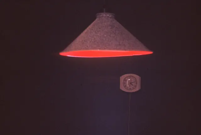 Mneme XVI: Learning to Draw: red incandescent lamp and clock detail