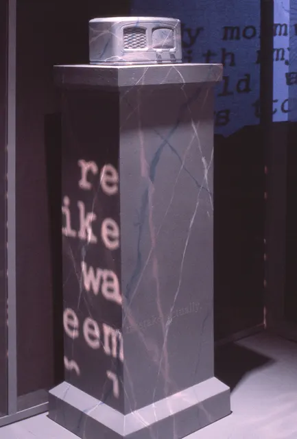 Mneme XVIII: Rites of Passage: detail: marbleized radio pedestal with vinyl and projected memory texts
