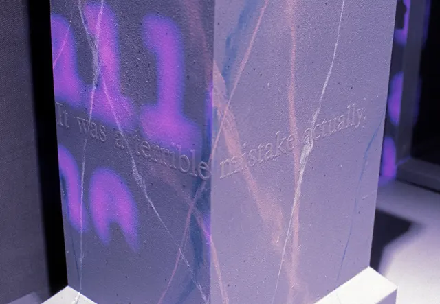 Mneme XVIII: Rites of Passage: detail: projection on pedestal; text: “It was a terrible mistake actually.”