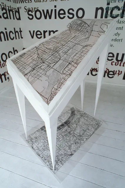 Mneme XXV: Traum [Dream]: illuminated bed and “rug” with translucent maps