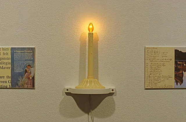 Surveying Desire X: Quest: detail of electric candle with romance and explorer friezes