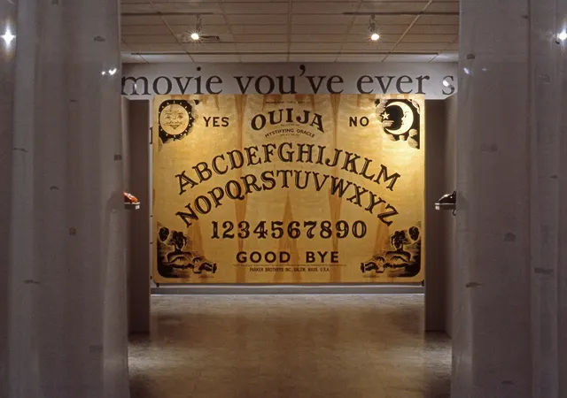 Surveying Desire XII: Fictions: view to rear of gallery with twelve-foot wide Ouija board