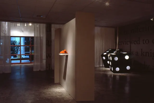 Surveying Desire XII: Fictions: view to front of gallery (suspended panel at left), orange telephone, four-foot dice